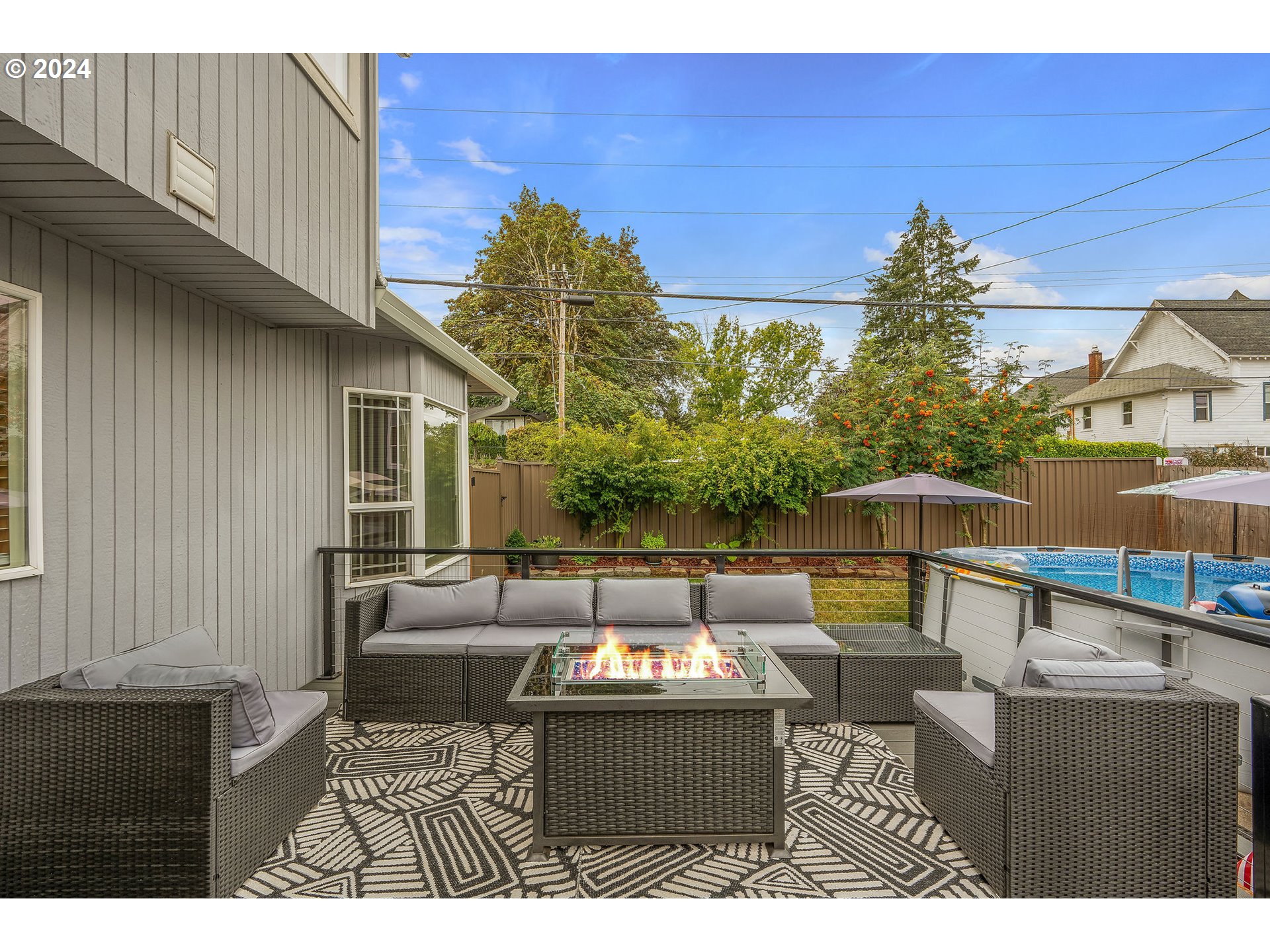 103 Park Street Gaston, OR 97119 - Photo 31 of 47 a view of a patio with couches and potted plants