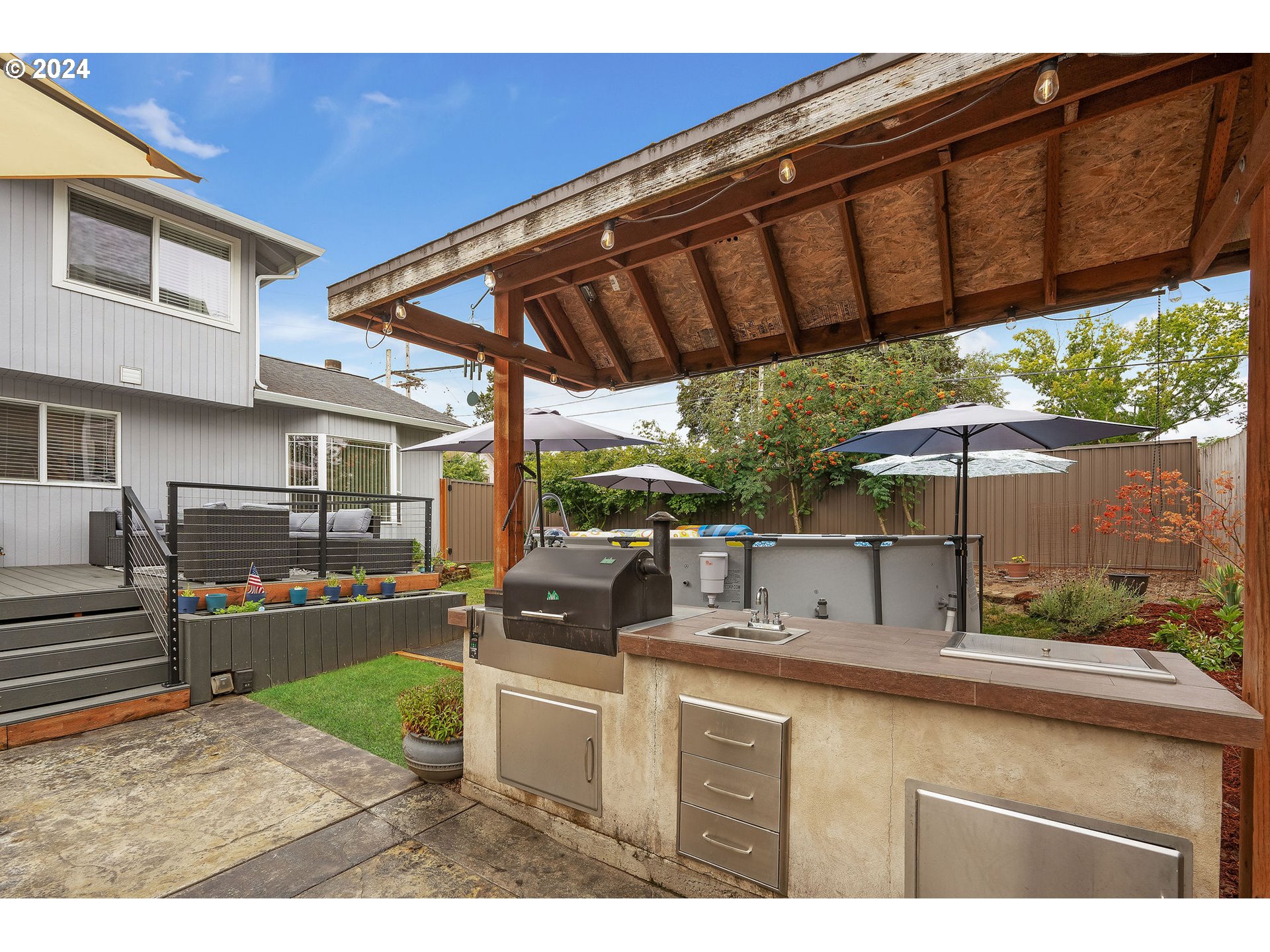 103 Park Street Gaston, OR 97119 - Photo 40 of 47 a backyard of a house with yard barbeque oven and outdoor seating