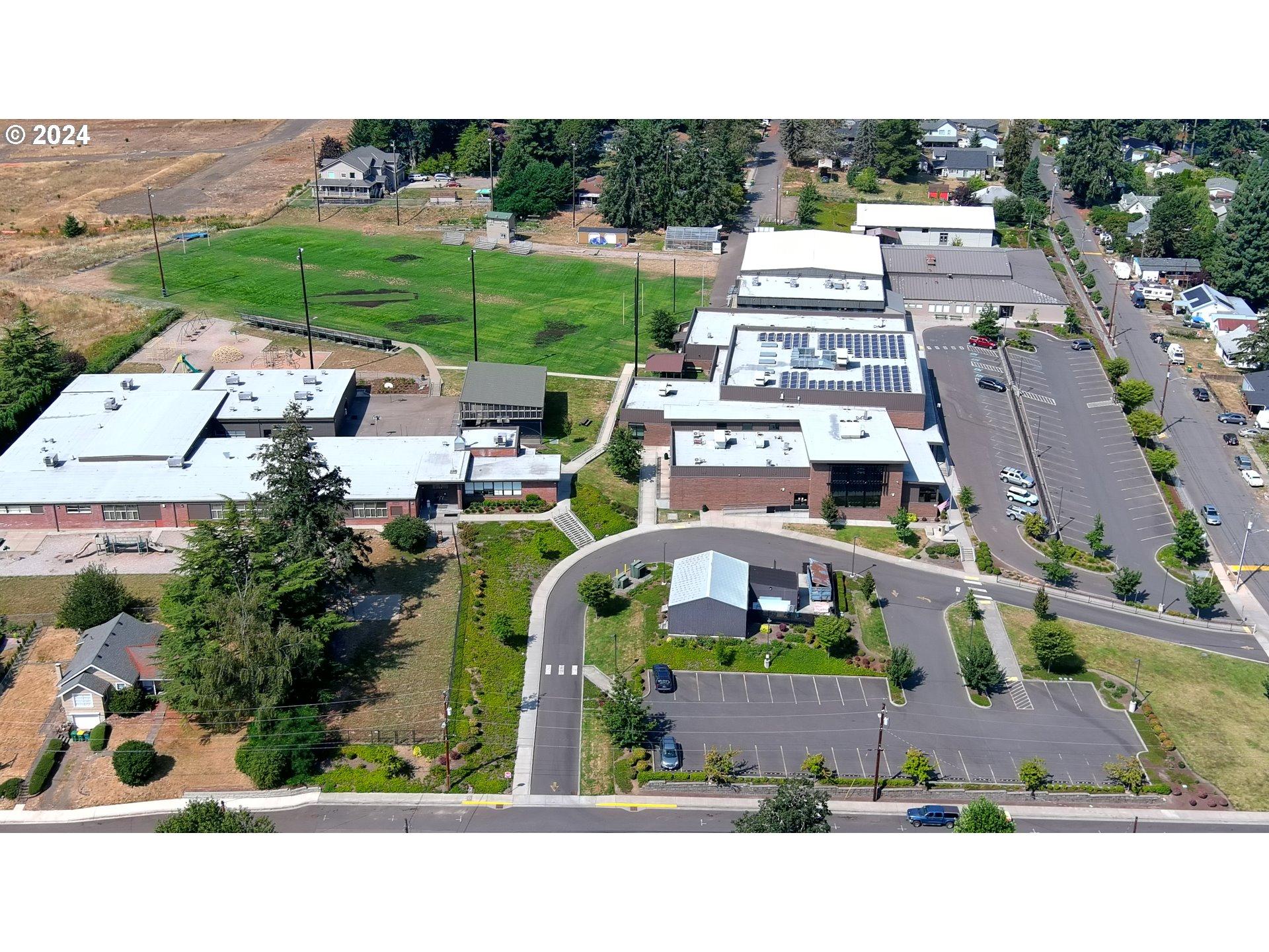 103 Park Street Gaston, OR 97119 - Photo 42 of 47 an aerial view of a house with a garden and lake view