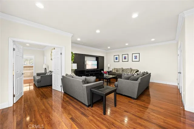 a bathroom with a granite countertop double vanity sink a mirror and a bathtub