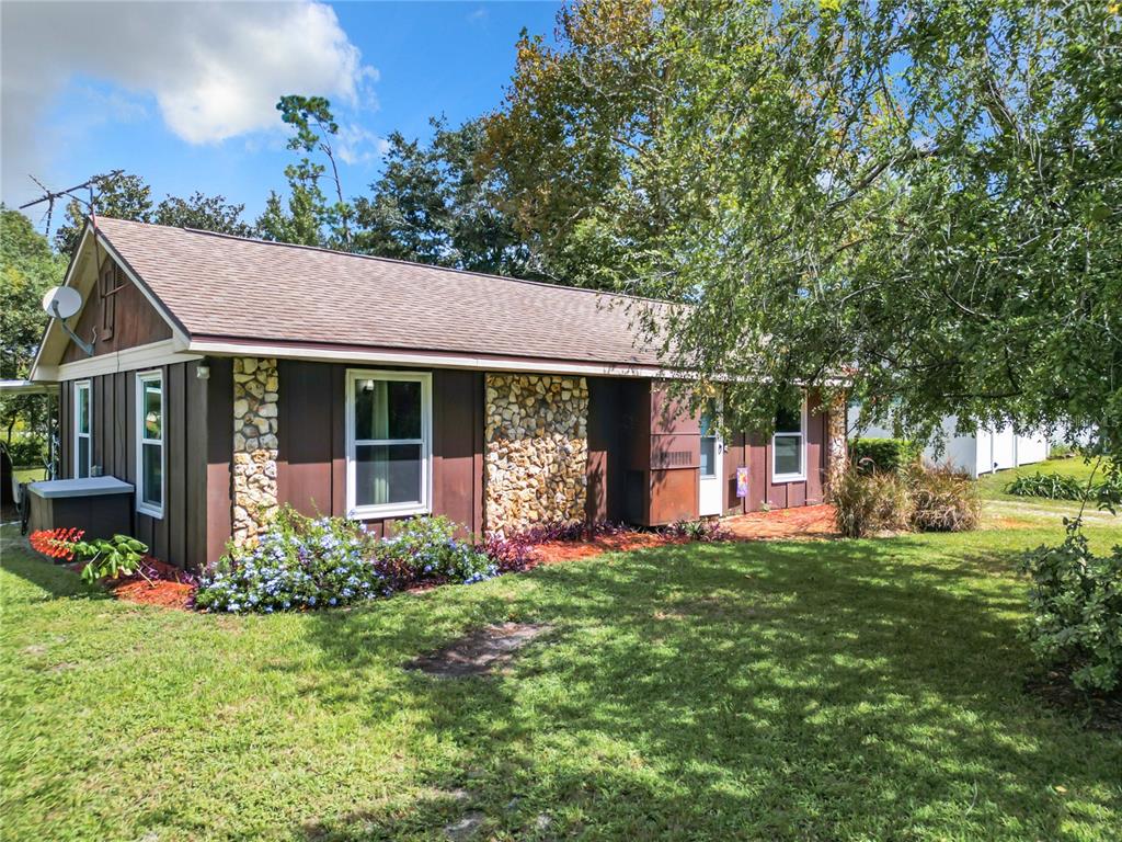 290 Valencia Road DeBary, FL 32713 - Photo 1 of 1 a front view of a house with a yard and porch