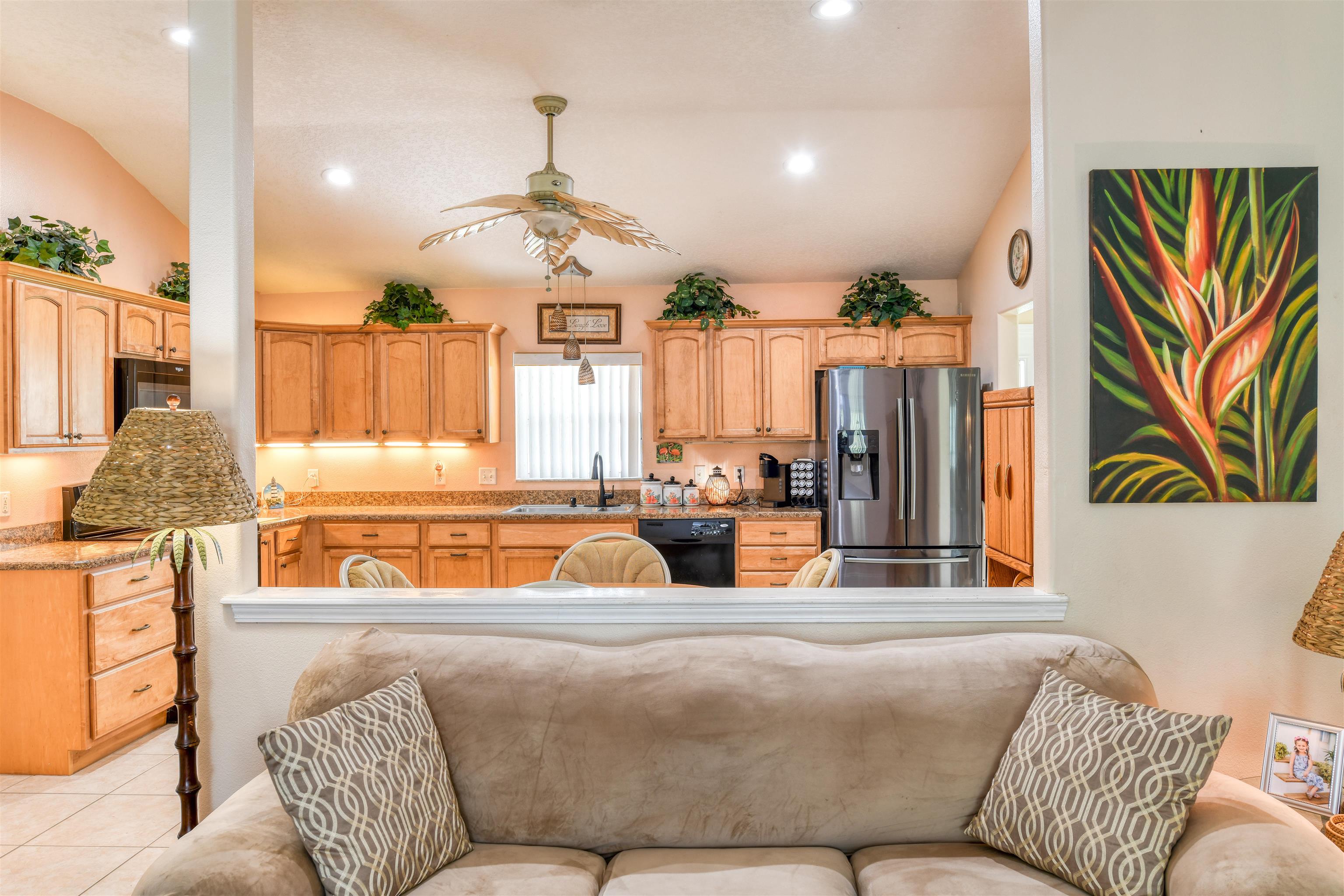 298 Ventura Road St. Augustine, FL 32080 - Photo 14 of 55 a living room with a couch and a chandelier