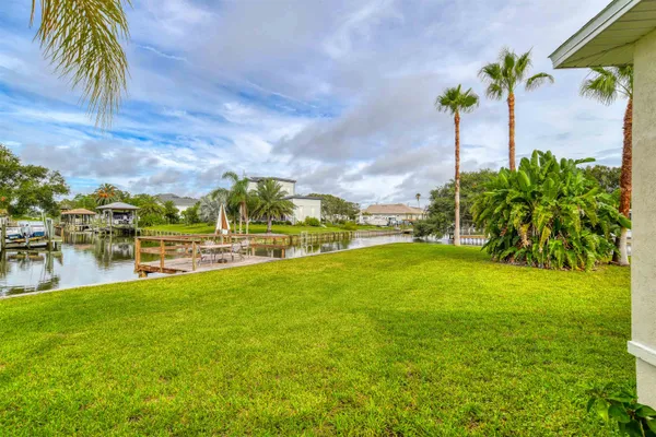 a view of a house with a backyard