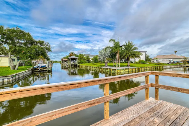a bedroom with bed and wooden furniture