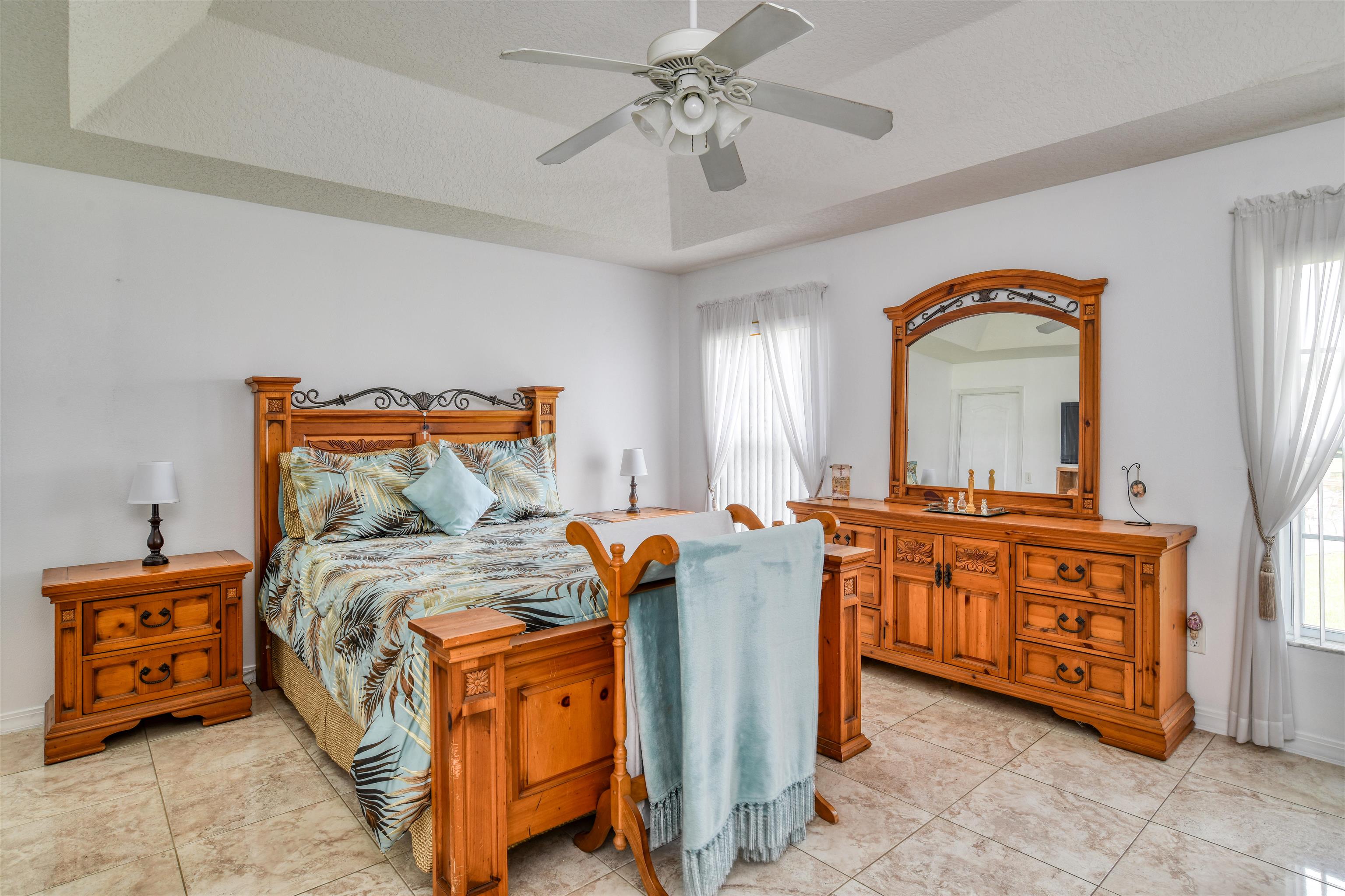 298 Ventura Road St. Augustine, FL 32080 - Photo 27 of 55 a bedroom with bed and wooden furniture