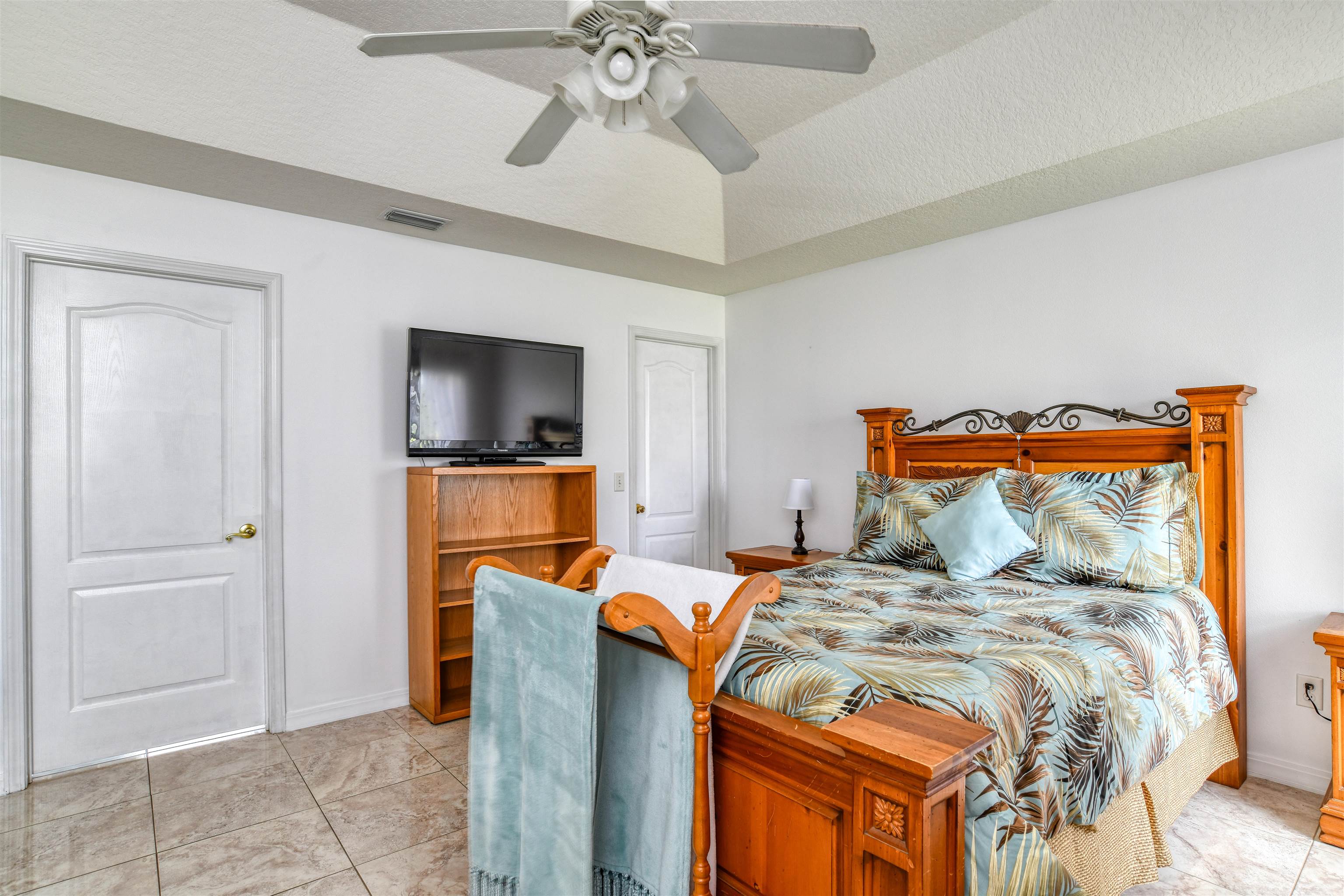 298 Ventura Road St. Augustine, FL 32080 - Photo 28 of 55 a bedroom with a bed and a flat screen tv