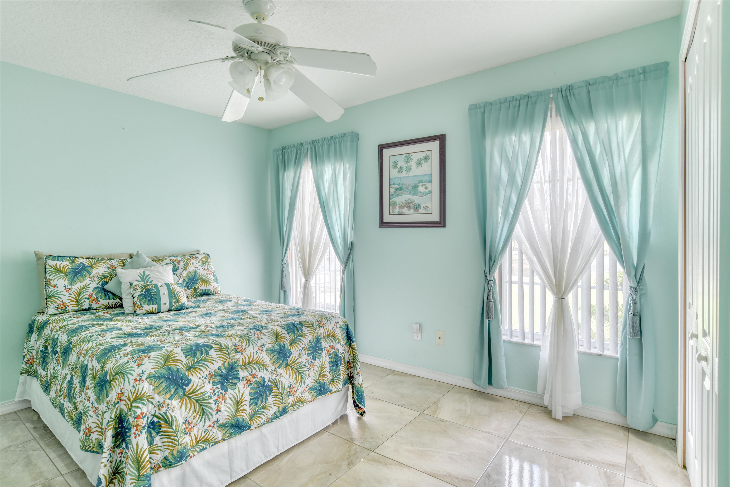 298 Ventura Road St. Augustine, FL 32080 - Photo 34 of 55 a bedroom with a bed and a chandelier