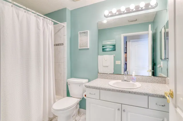 a view of a bathroom from a hallway