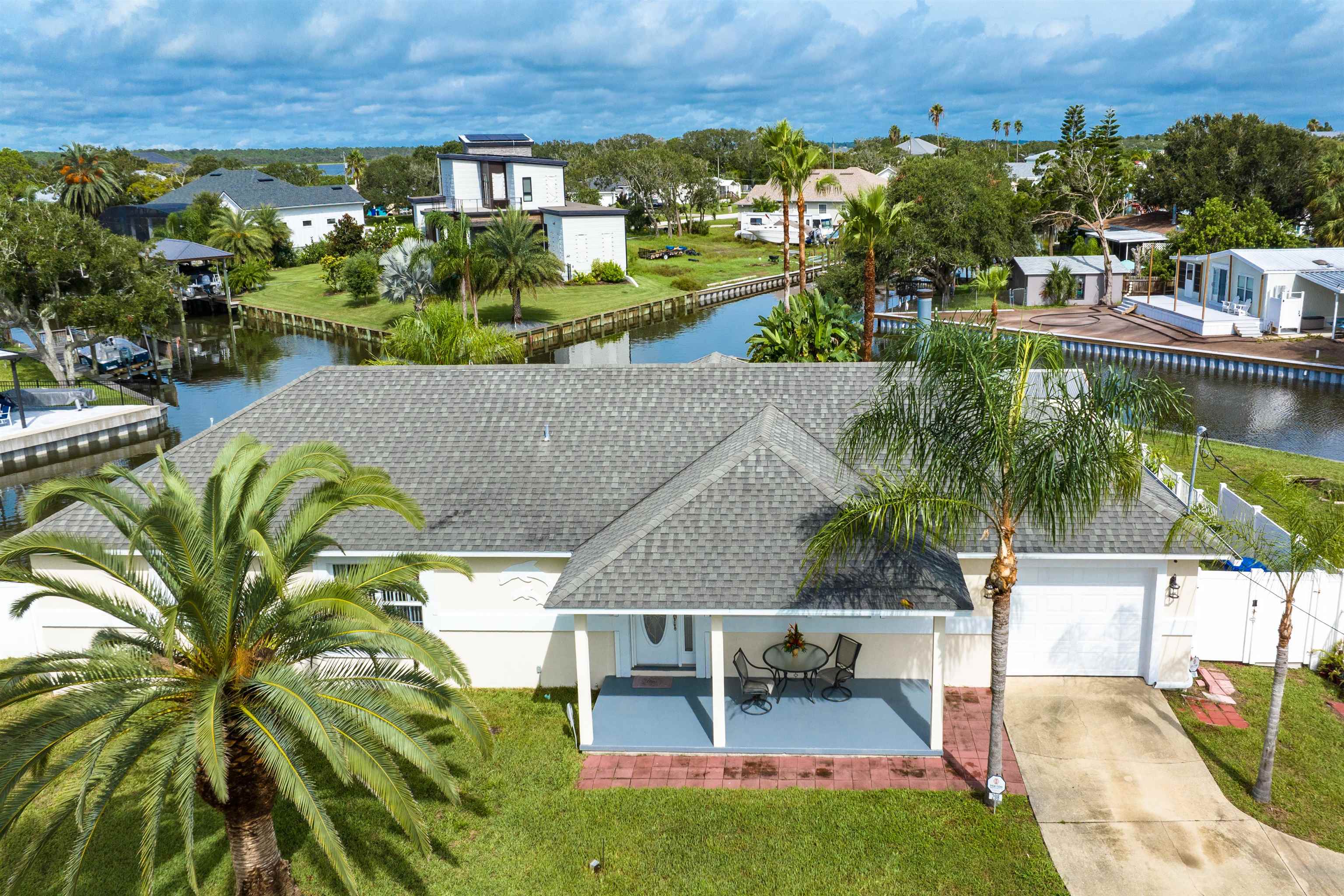 298 Ventura Road St. Augustine, FL 32080 - Photo 51 of 55 an aerial view of a house with a garden and lake view