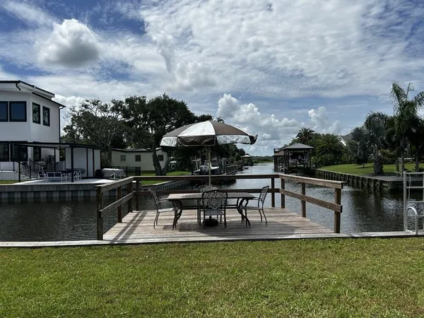 a view of a hallway with entryway and front door