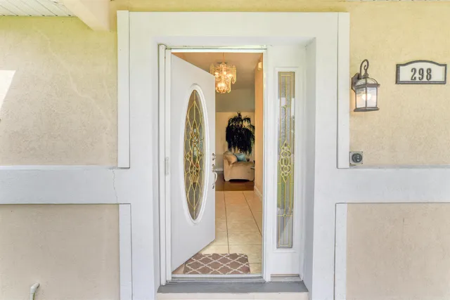 a kitchen with stainless steel appliances a stove a sink and a refrigerator