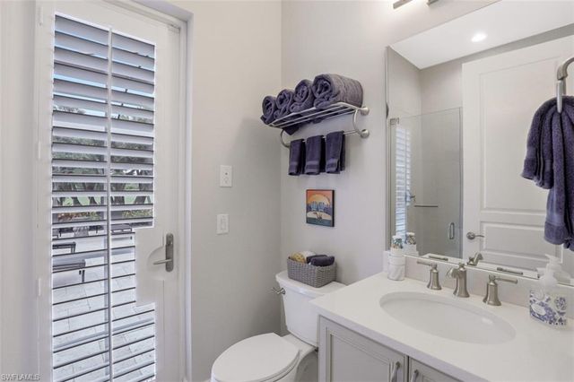 a kitchen with granite countertop a sink and cabinets