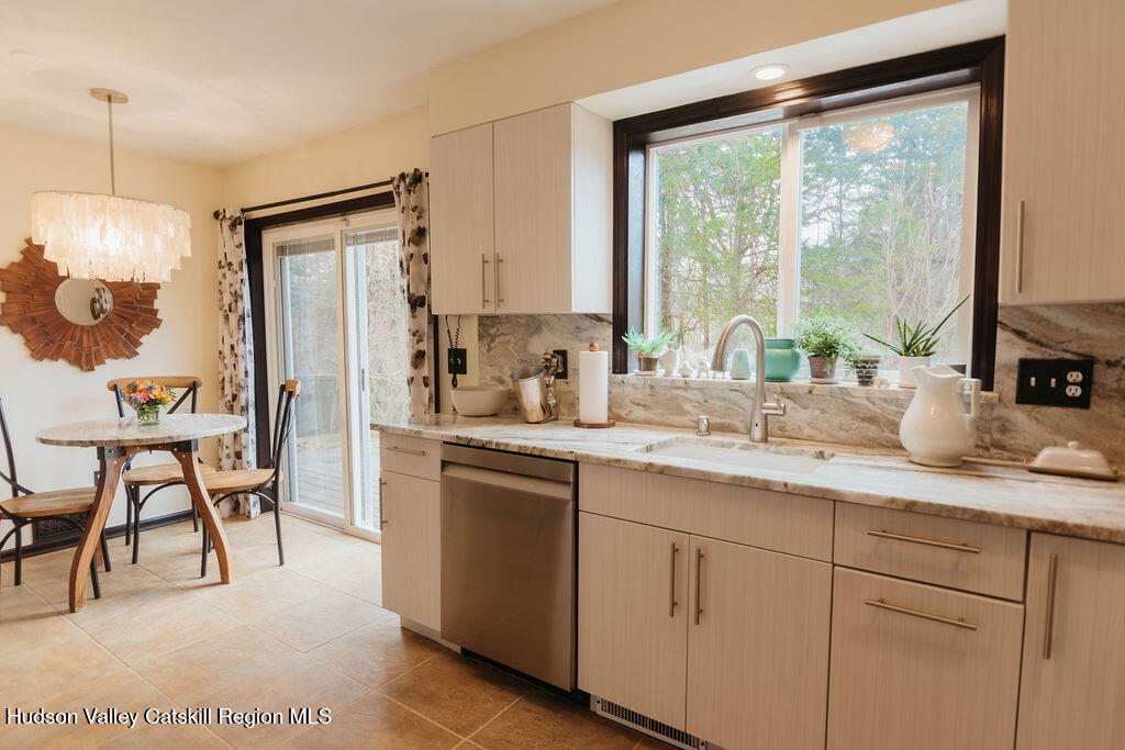 1 Rapp Hill Road New Paltz, NY 12561 - Photo 12 of 45 a kitchen with a sink and white cabinets