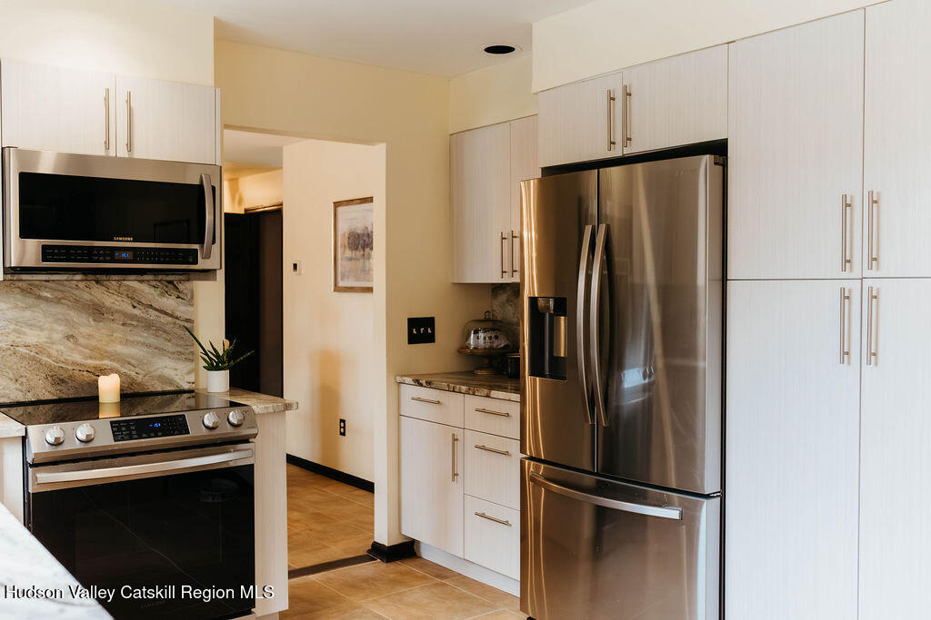 1 Rapp Hill Road New Paltz, NY 12561 - Photo 13 of 45 a kitchen with stainless steel appliances a refrigerator stove and microwave