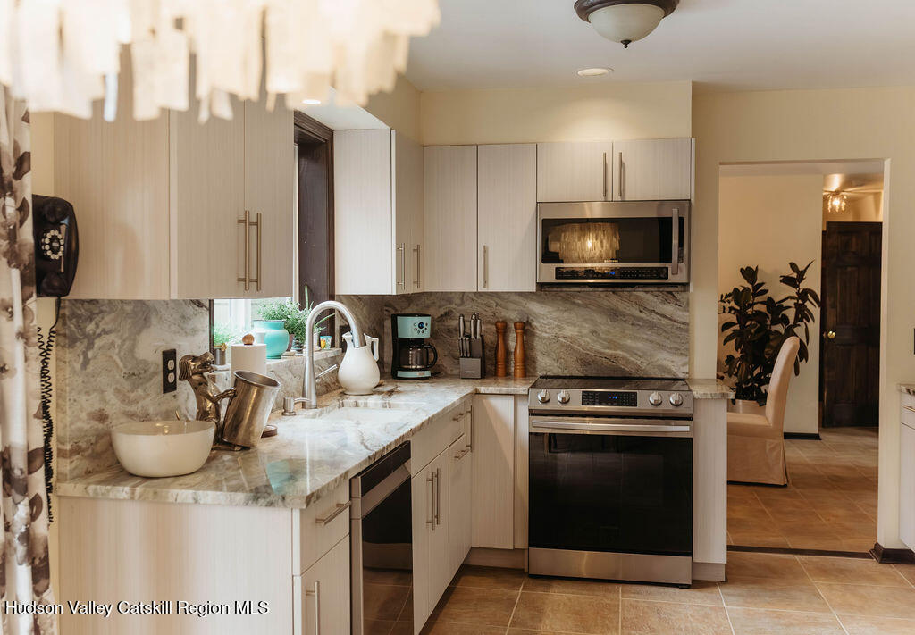 1 Rapp Hill Road New Paltz, NY 12561 - Photo 15 of 45 a kitchen with a sink stove and microwave