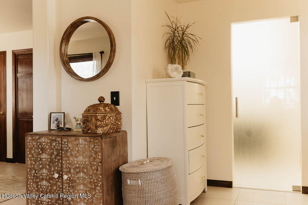 1 Rapp Hill Road New Paltz, NY 12561 - Photo 20 of 45 a bathroom with a sink a mirror and a shower
