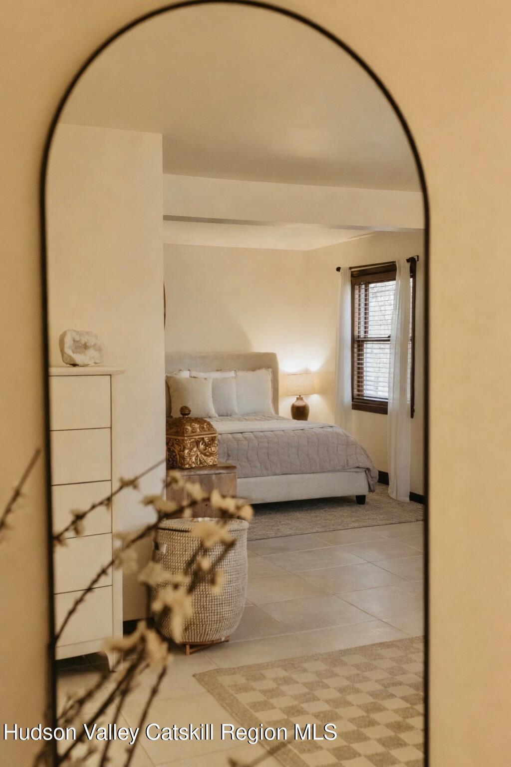 1 Rapp Hill Road New Paltz, NY 12561 - Photo 21 of 45 a bedroom with a bed and a mirror