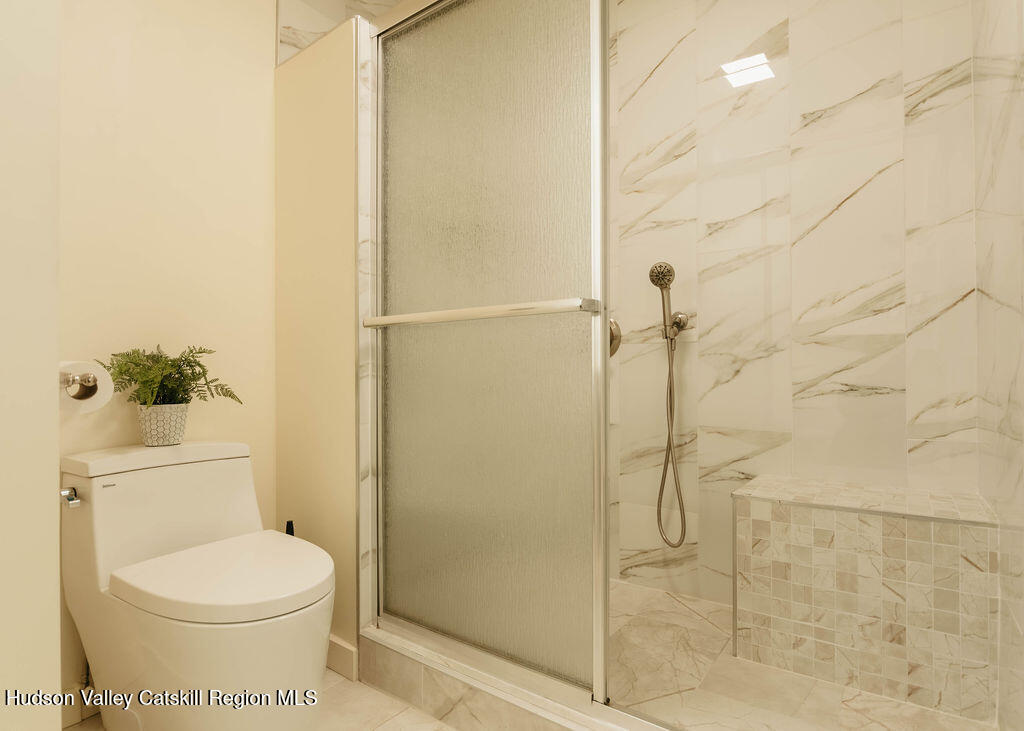 1 Rapp Hill Road New Paltz, NY 12561 - Photo 24 of 45 a bathroom with a toilet and a shower