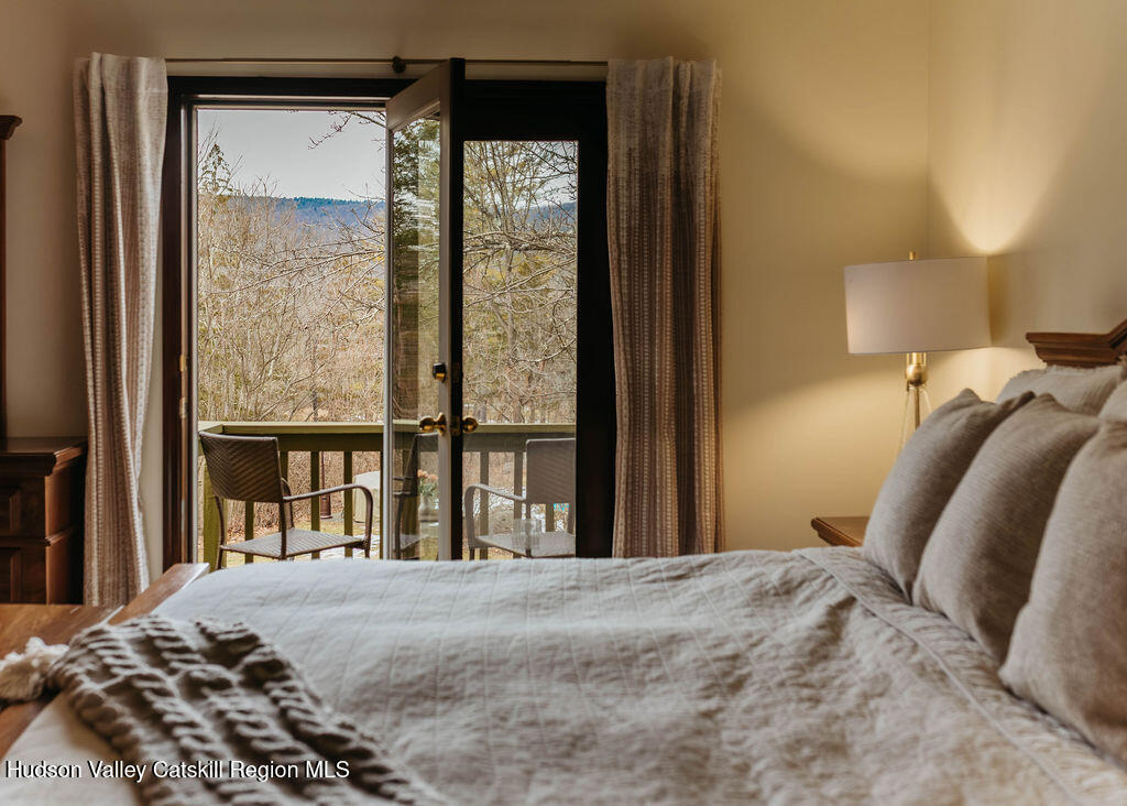 1 Rapp Hill Road New Paltz, NY 12561 - Photo 32 of 45 a bedroom with a bed and a large window