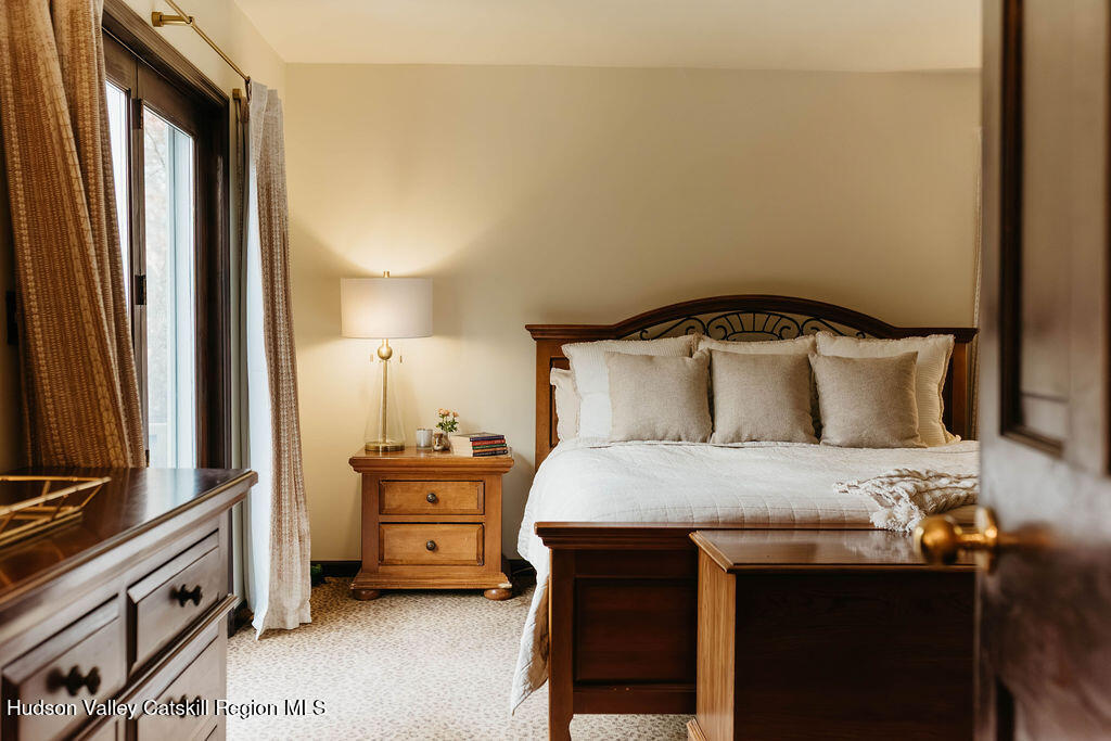 1 Rapp Hill Road New Paltz, NY 12561 - Photo 33 of 45 a bedroom with a bed and a dresser