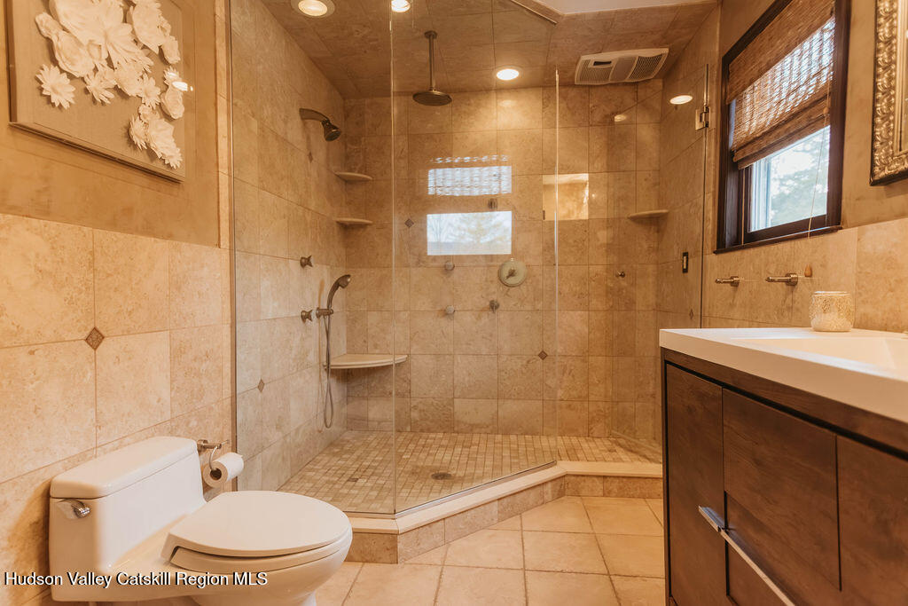 1 Rapp Hill Road New Paltz, NY 12561 - Photo 34 of 45 a bathroom with a granite countertop sink toilet and shower