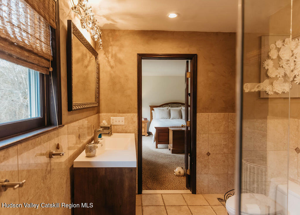 1 Rapp Hill Road New Paltz, NY 12561 - Photo 35 of 45 a bathroom with a sink and a mirror