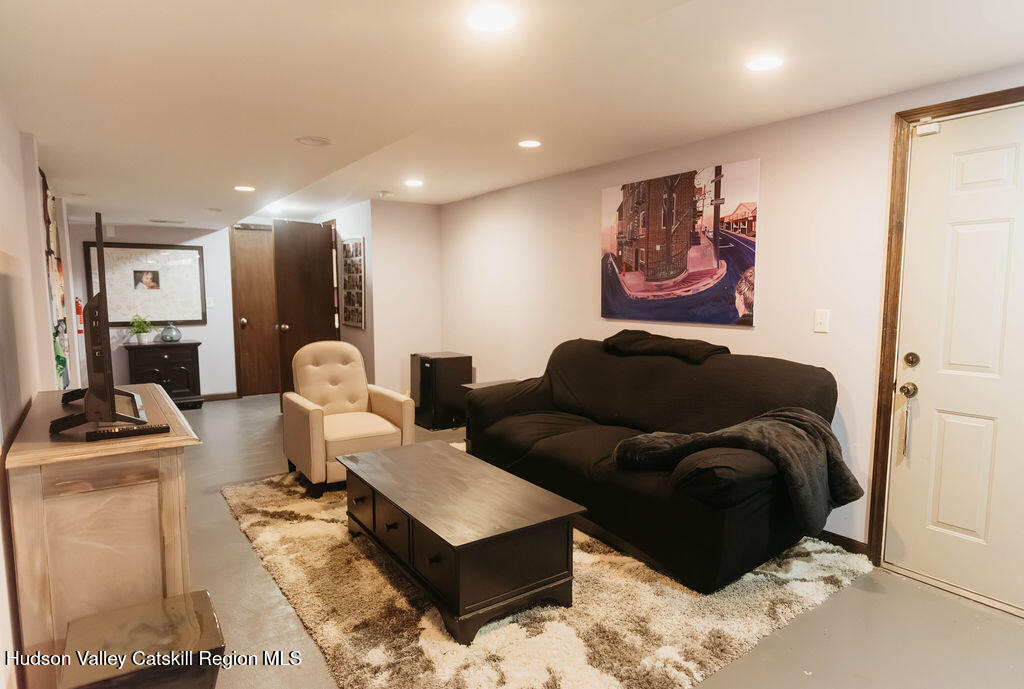 1 Rapp Hill Road New Paltz, NY 12561 - Photo 37 of 45 a living room with furniture and a flat screen tv