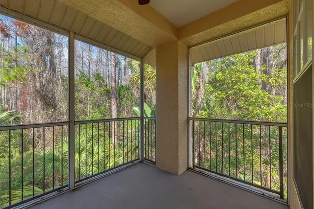 an aerial view of a house with garden space and street view