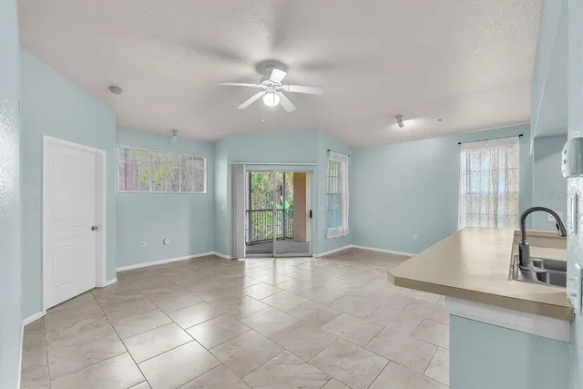 a view of livingroom with kitchen view and wooden floor