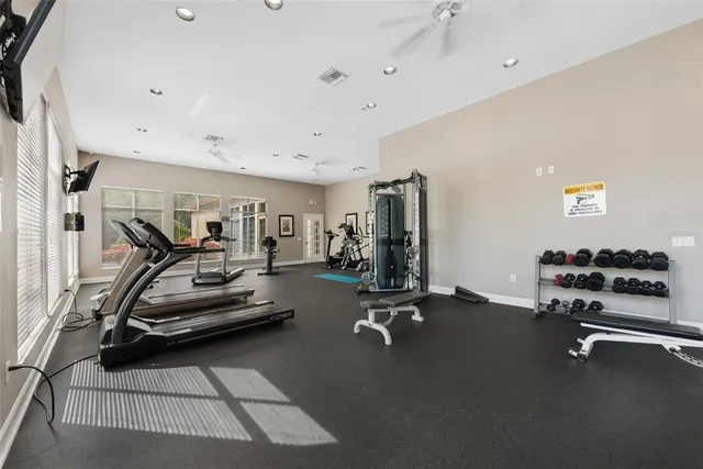 an aerial view of a house with a garden and outdoor seating