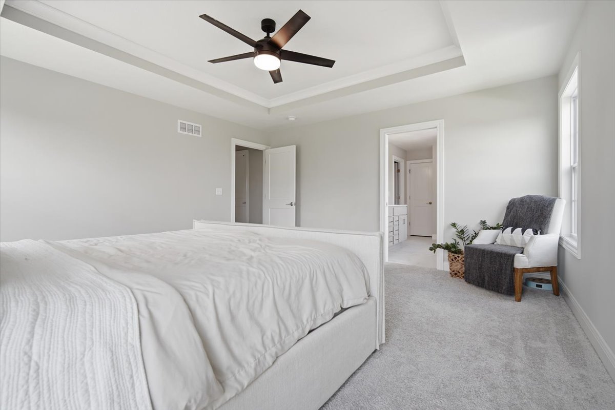5407 Ferryman Road Bloomington, IL 61705 - Photo 20 of 61 a bedroom with a bed and ceiling fan