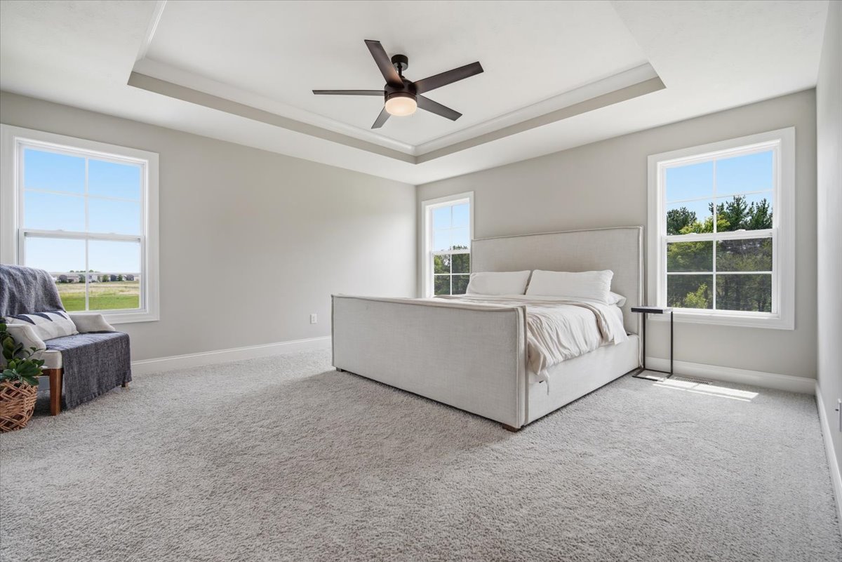 5407 Ferryman Road Bloomington, IL 61705 - Photo 22 of 61 a bed room with a bed and a couch