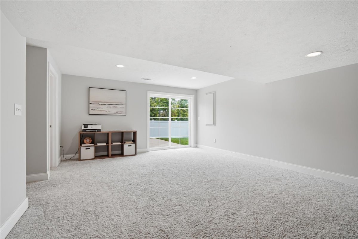 5407 Ferryman Road Bloomington, IL 61705 - Photo 36 of 61 an empty room with windows and couches