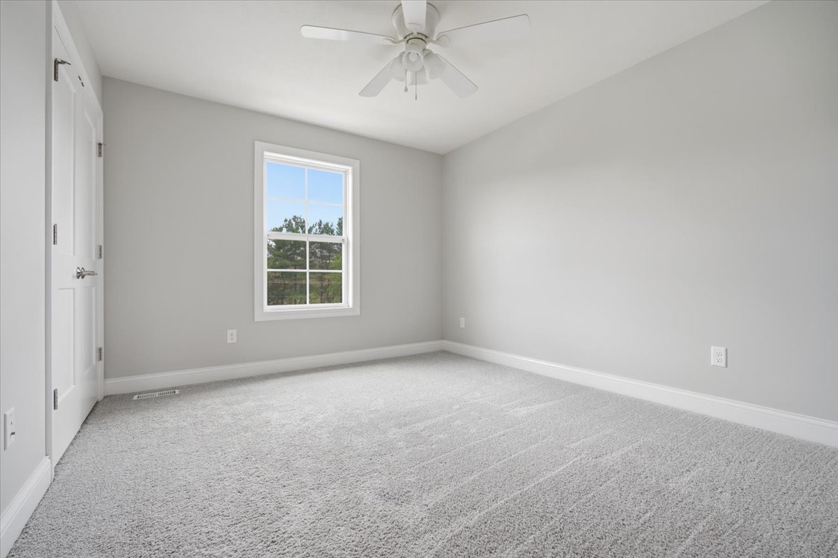 5407 Ferryman Road Bloomington, IL 61705 - Photo 42 of 61 a view of an empty room with a window