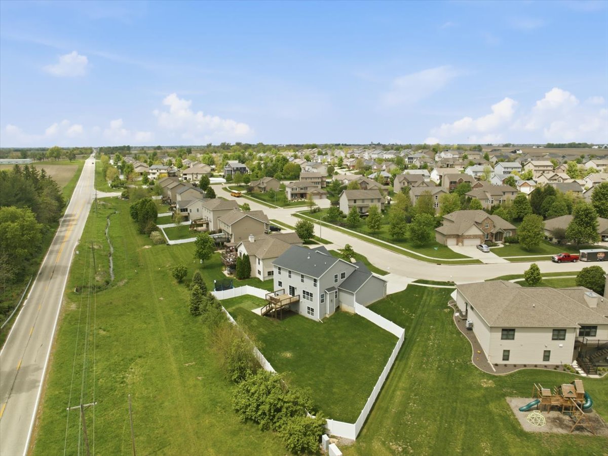 5407 Ferryman Road Bloomington, IL 61705 - Photo 52 of 61 an aerial view of residential houses with outdoor space and trees