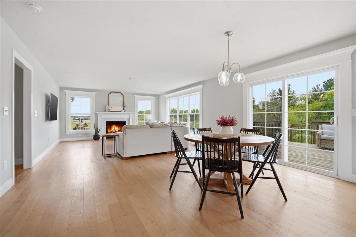 5407 Ferryman Road Bloomington, IL 61705 - Photo 8 of 61 a view of a dining room with furniture window and wooden floor