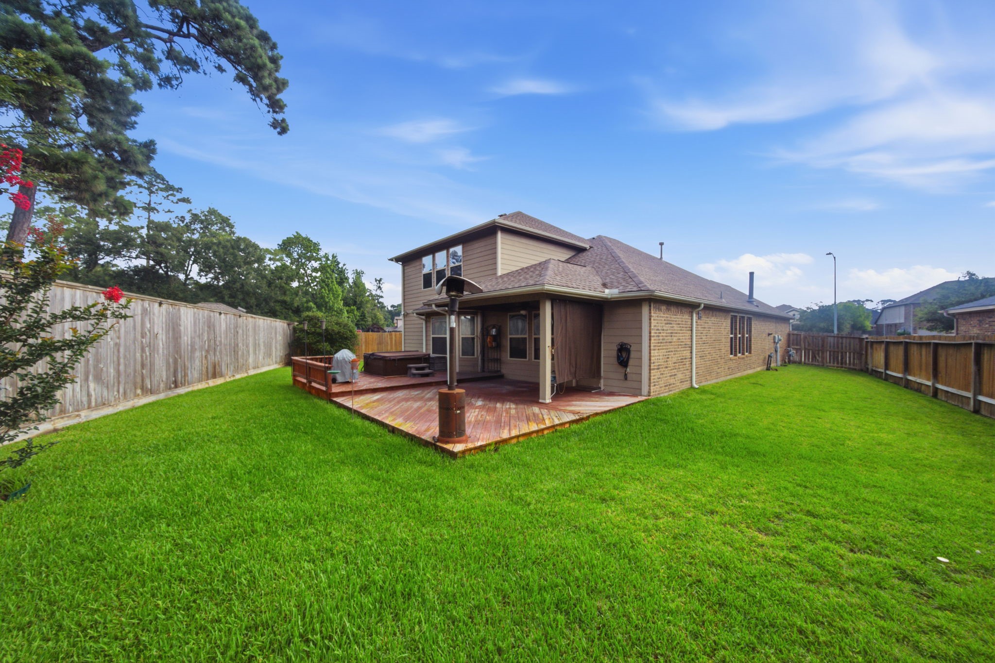 7611 Willow School Drive Spring, TX 77389 - Photo 18 of 23 a view of a house with a yard porch and sitting area