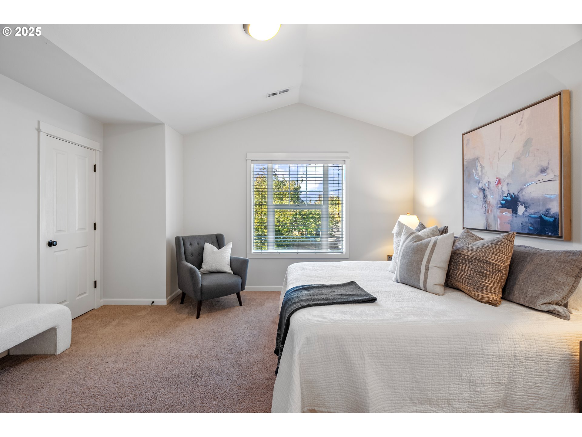4646 North Commercial Avenue Portland, OR 97217 - Photo 19 of 31 a bedroom with a bed and a painting on the wall
