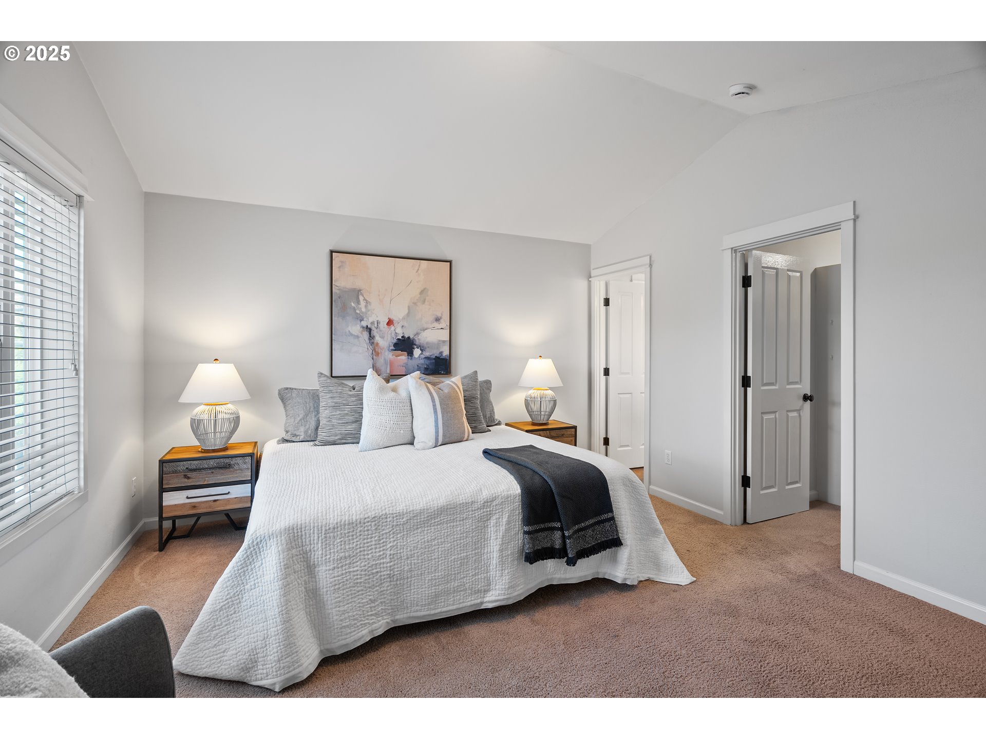 4646 North Commercial Avenue Portland, OR 97217 - Photo 20 of 31 a bedroom with a bed and a painting on the wall