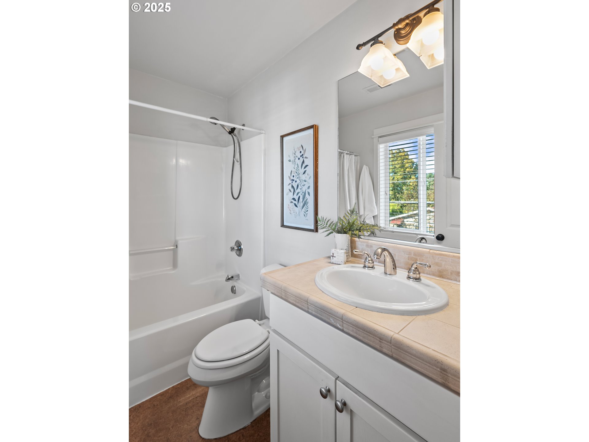 4646 North Commercial Avenue Portland, OR 97217 - Photo 22 of 31 a bathroom with a sink a toilet and shower