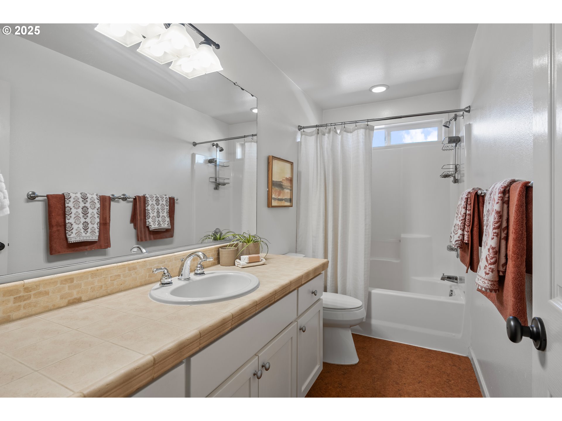 4646 North Commercial Avenue Portland, OR 97217 - Photo 26 of 31 a bathroom with a sink a toilet a shower and a mirror