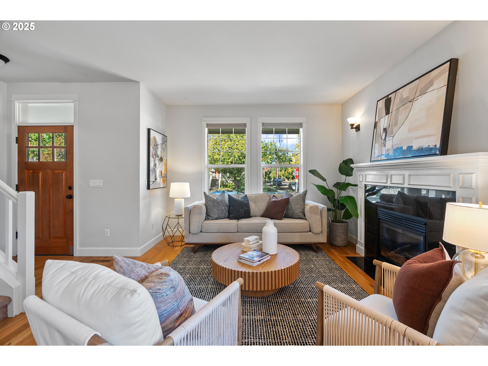 4646 North Commercial Avenue Portland, OR 97217 - Photo 4 of 31 a living room with furniture a fireplace and a large window