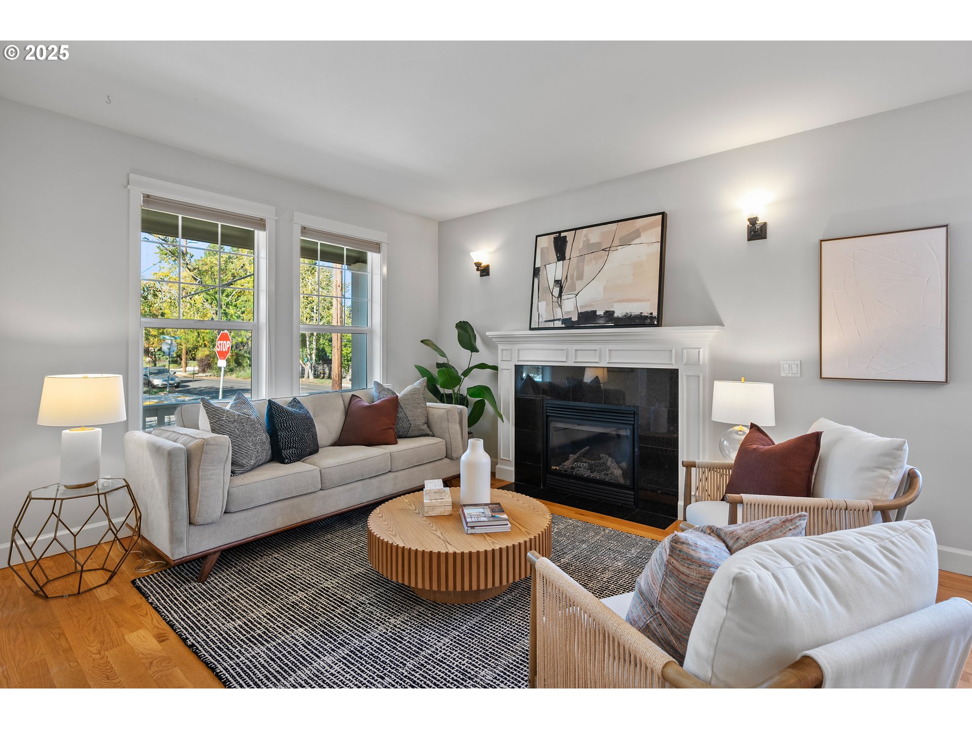 4646 North Commercial Avenue Portland, OR 97217 - Photo 5 of 31 a living room with furniture a window and a fireplace