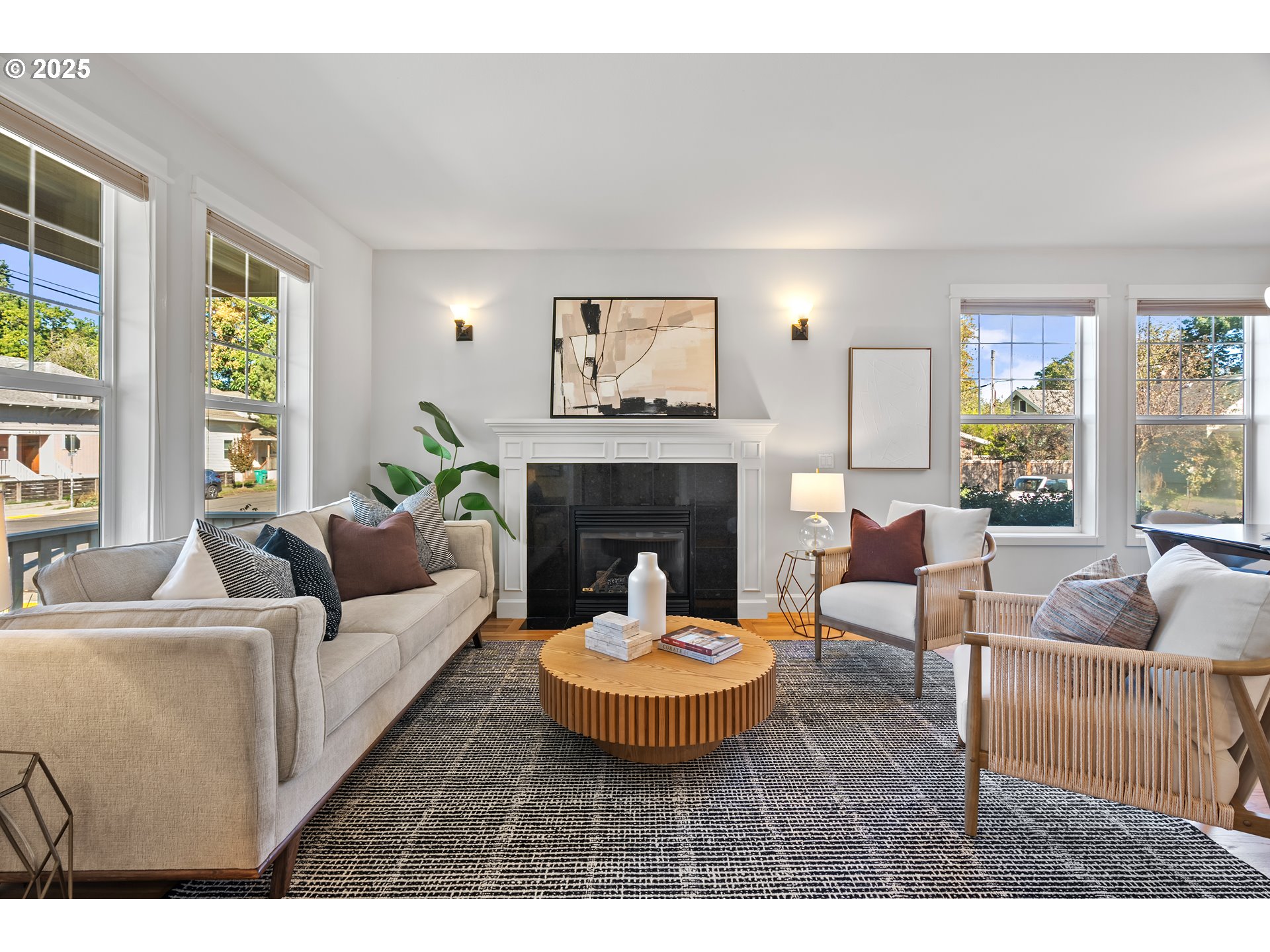 4646 North Commercial Avenue Portland, OR 97217 - Photo 6 of 31 a living room with furniture a large window and a fireplace