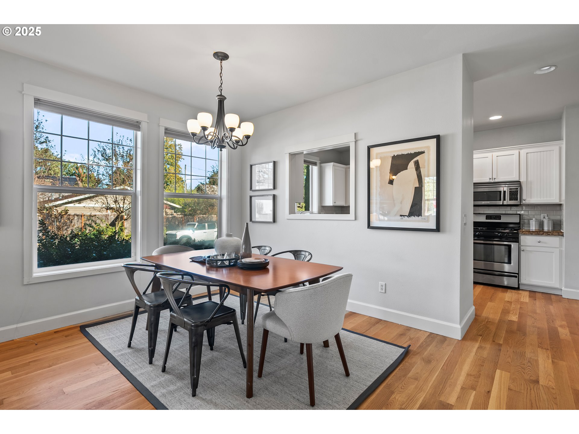 4646 North Commercial Avenue Portland, OR 97217 - Photo 10 of 31 a view of a dining room with furniture wooden floor and chandelier