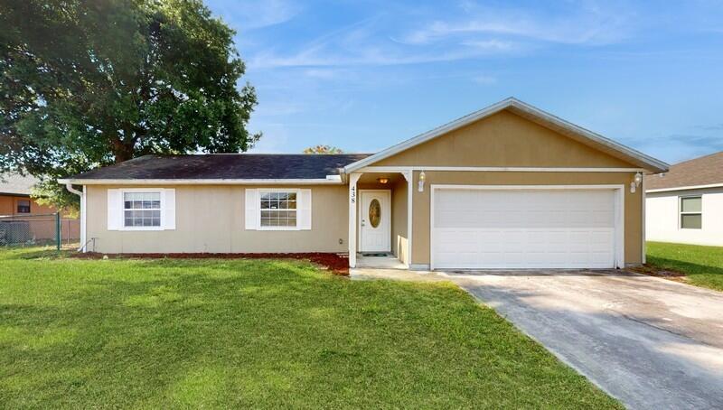 438 Southwest Cherryhill Road Port St. Lucie, FL 34953 - Photo 1 of 37 Front