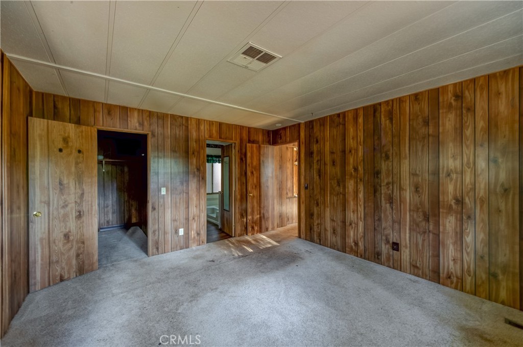 6613 Hupp Coutolenc Road Magalia, CA 95954 - Photo 17 of 20 a view of a hallway with wooden walls