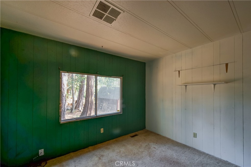 6613 Hupp Coutolenc Road Magalia, CA 95954 - Photo 20 of 20 a room with a window and a ceiling fan