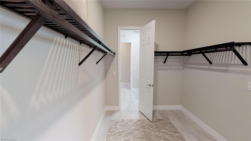 20259 Kingmont Drive Estero, FL 33928 - Photo 13 of 14 a view of an empty walk in closet