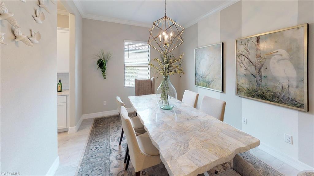 20259 Kingmont Drive Estero, FL 33928 - Photo 14 of 14 a view of a dining room with furniture and a chandelier